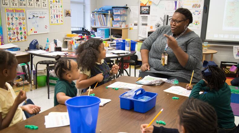 Kindergarten teacher Kimyatta Walker works with her students at Narvie Harris Elementary School Thursday, November 2, 2017. STEVE SCHAEFER / SPECIAL TO THE AJC