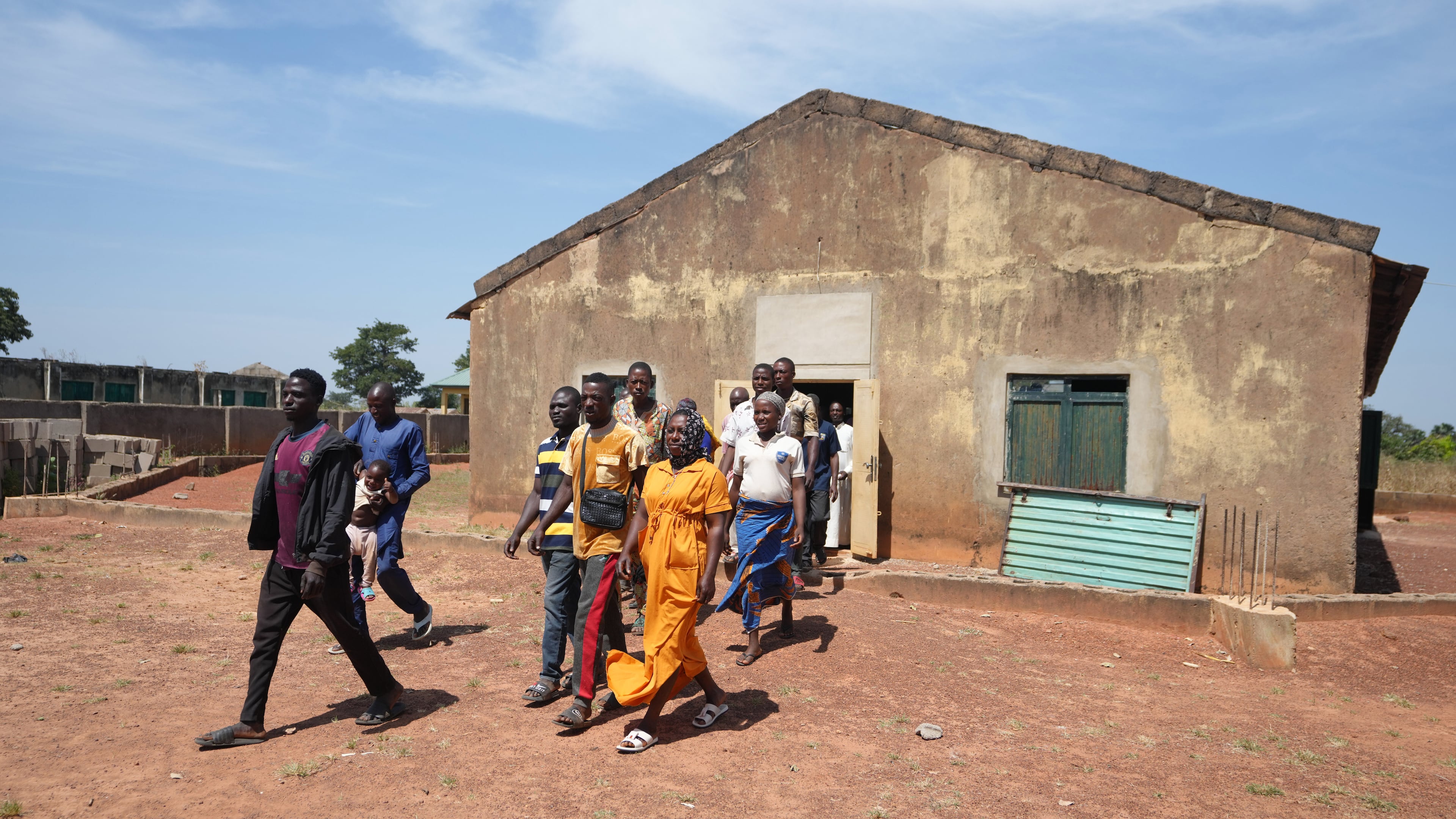 People who were kidnapped during a church service in November 2024 leave after a church meeting in Kaduna, northwestern Nigeria, Nov. 6, 2025.(AP Photo/Sunday Alamba)