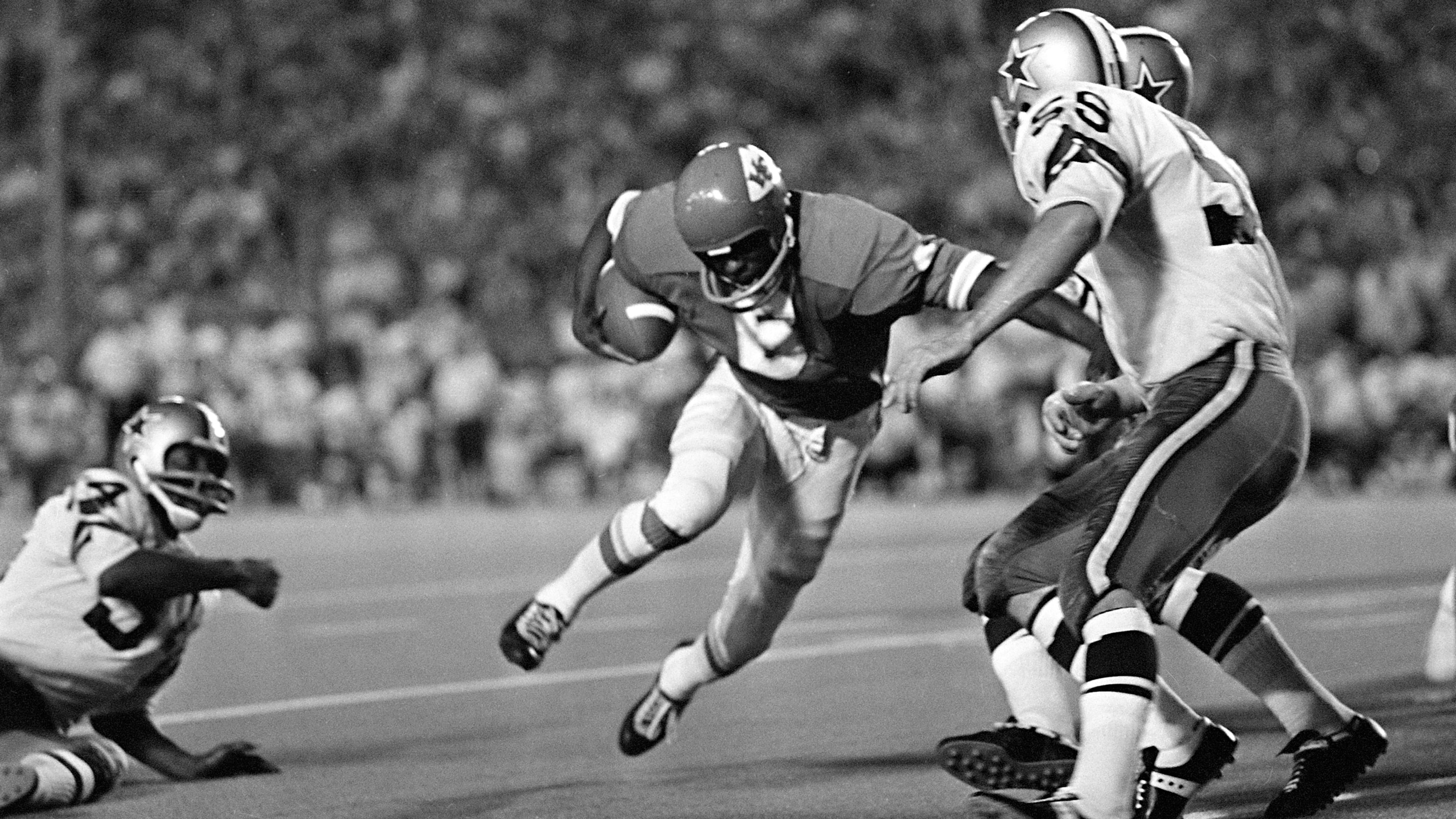 FILE - Warren McVea (6) Kansas City Chiefs running back is stopped on an end run by Dallas Cowboy Leroy Jordan (55) in the first quarter action in Dallas, Sept. 5, 1970. (AP Photo/Fred Kaufman,File)