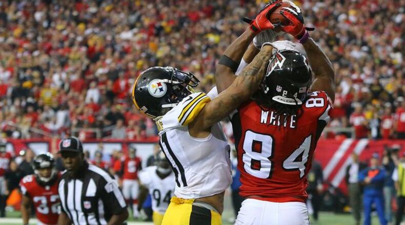 Falcons wide receiver Roddy White sets the franchise record with his 62nd touchdown reception against Steelers cornerback Antwon Blake during the fourth quarter Sunday. CURTIS COMPTON / CCOMPTON@AJC.COM