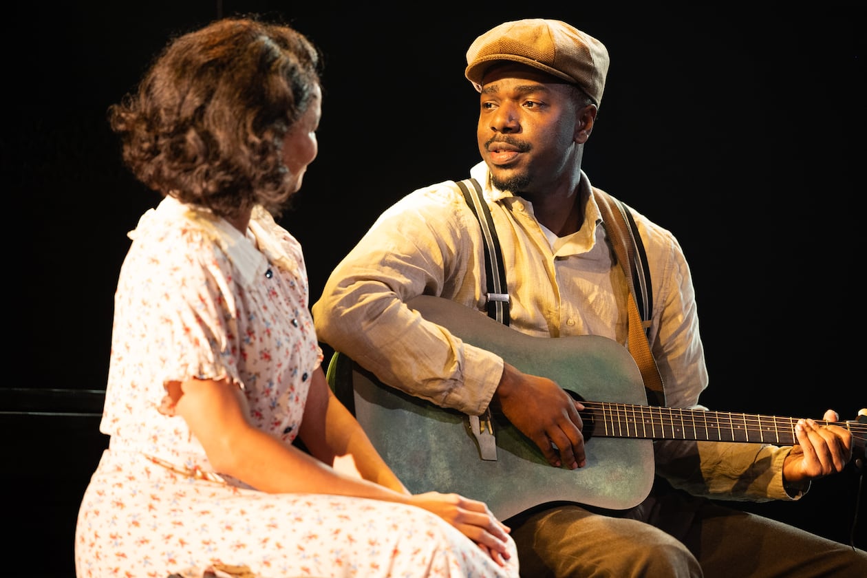 Jade Payton as Avery (left) with Jemarcus Kilgore as blues guitarist Johnny “Honeycomb” James, whose return from the road with otherworldly musical talent causes whispers in his small Georgia town, in "Covenant" at the Alliance Theatre. (Courtesy of Greg Mooney)