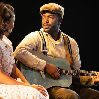 Jade Payton as Avery (left) with Jemarcus Kilgore as blues guitarist Johnny “Honeycomb” James, whose return from the road with otherworldly musical talent causes whispers in his small Georgia town, in "Covenant" at the Alliance Theatre. (Courtesy of Greg Mooney)