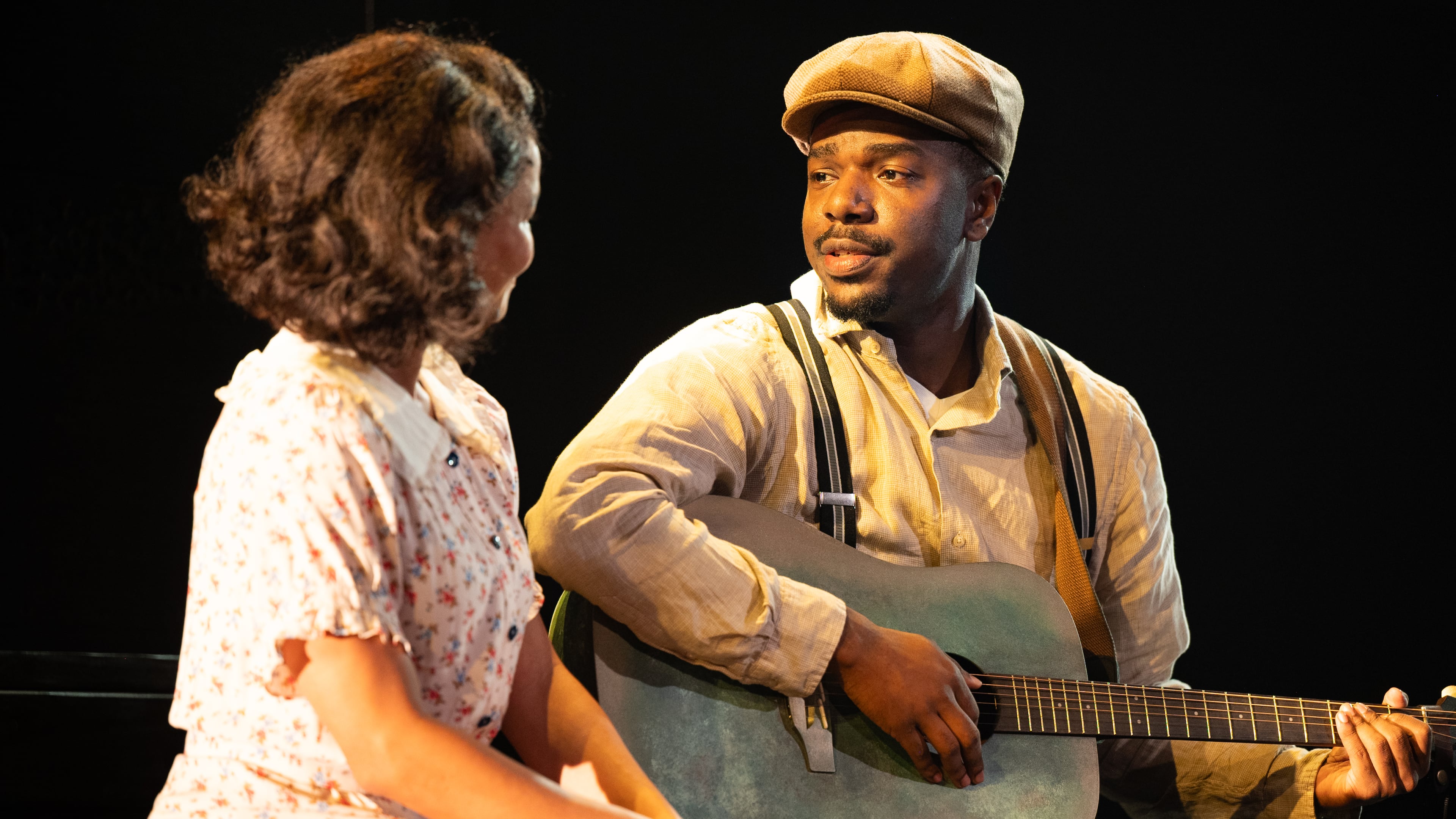 Jade Payton as Avery (left) with Jemarcus Kilgore as blues guitarist Johnny “Honeycomb” James, whose return from the road with otherworldly musical talent causes whispers in his small Georgia town, in "Covenant" at the Alliance Theatre. (Courtesy of Greg Mooney)