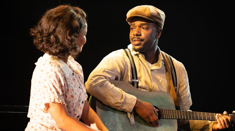 Jade Payton as Avery (left) with Jemarcus Kilgore as blues guitarist Johnny “Honeycomb” James, whose return from the road with otherworldly musical talent causes whispers in his small Georgia town, in "Covenant" at the Alliance Theatre. (Courtesy of Greg Mooney)