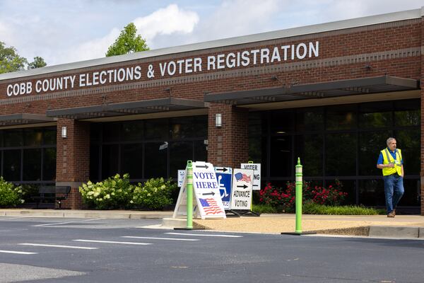 A poll worker exits the Cobb County Elections & Voter Registration building in Marietta on Tuesday, June 10, 2025, during early voting in the low-turnout Georgia Public Service Commission election. (Arvin Temkar / AJC)