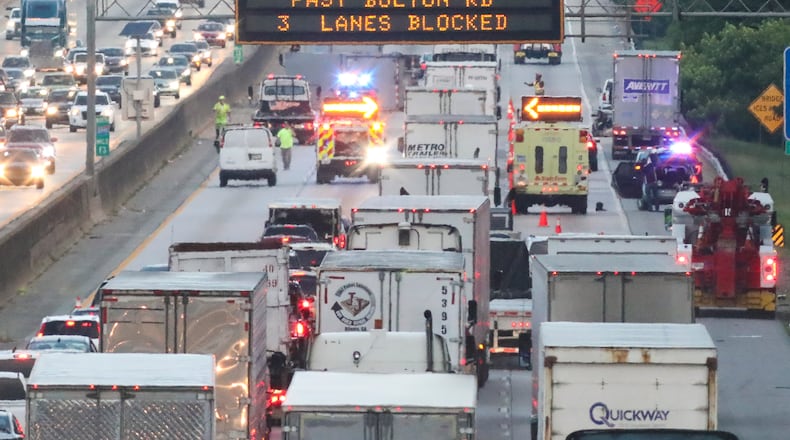 Plenty of trucks already clog metro Atlanta highways. More may be coming as the Port of Savannah expands. JOHN SPINK/JSPINK@AJC.COM
