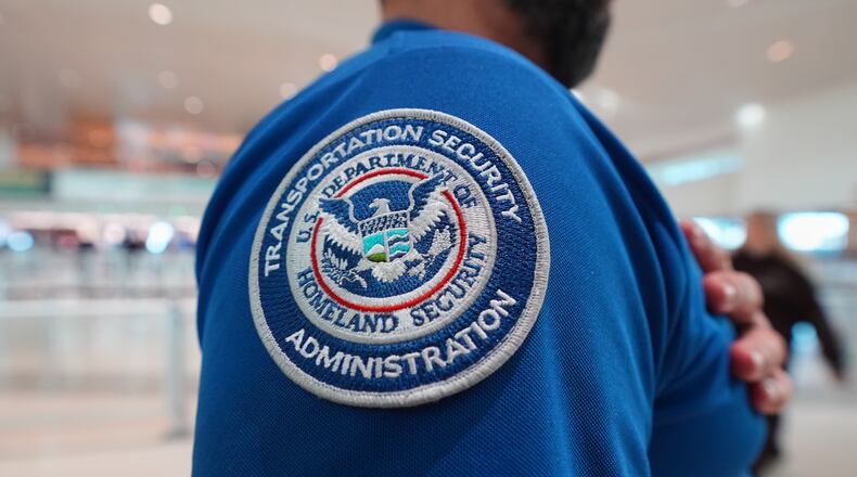 A TSA agent wears a U.S. Department of Homeland Security patch on their uniform at Love Field Airport, in Dallas, Wednesday, Feb. 18, 2026. (AP Photo/LM Otero)