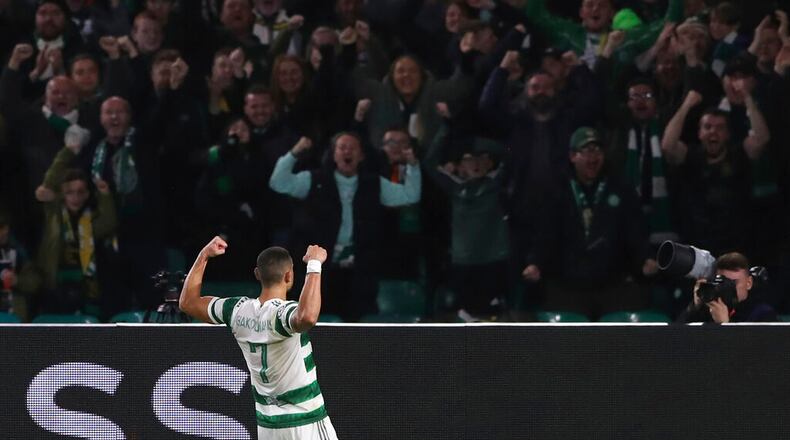 Celtic's Giorgos Giakoumakis celebrates after scoring the opening goal during the Champions League Group F soccer match between Celtic and Shakhtar Donetsk at Celtic park, Glasgow, Scotland, Tuesday, Oct. 25, 2022. (AP Photo/Scott Heppell)