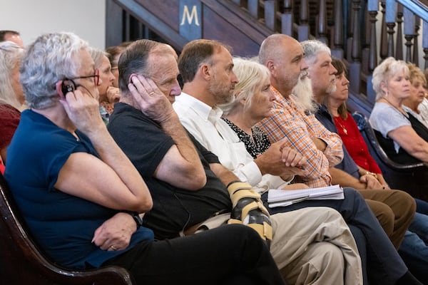Residents, including some plaintiffs in the front row, attend a hearing over attorneys fees regarding lawsuits against Rivian’s electric vehicle factory on Aug. 13. (Arvin Temkar/AJC)