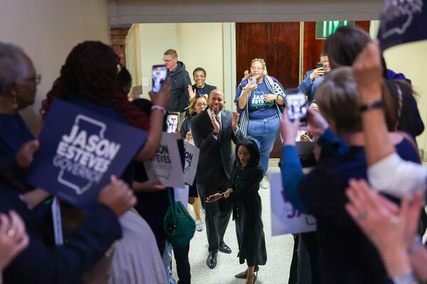 Democratic candidate for governor Jason Esteves is greeted by supporters as he enters to file paperwork to run for election at the Capitol in Atlanta on Monday, March 2, 2026. (Arvin Temkar/AJC)