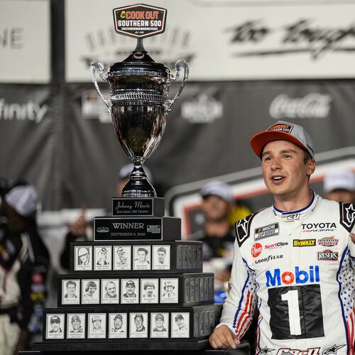 Christopher Bell celebrates in Victory Lane after winning a NASCAR Cup Series auto race Sunday, Sept. 6, 2026, in Darlington, S.C. (AP Photo/Matt Kelley)