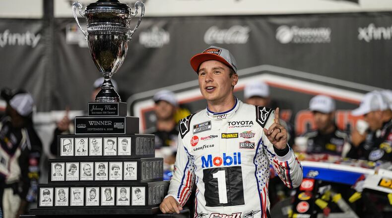 Christopher Bell celebrates in Victory Lane after winning a NASCAR Cup Series auto race Sunday, Sept. 6, 2026, in Darlington, S.C. (AP Photo/Matt Kelley)