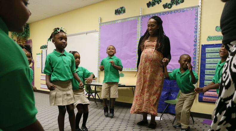 Aug. 3, 2015 - Atlanta - Stephanie Reaves' Kindergarten class plays a game as they introduce themselves on the first day of school at Kindezi at Old Fourth Ward in Atlanta. The school joined Kindezi School West in the charter organization's line-up, which has since expanded to include Gideons Elementary. BOB ANDRES / BANDRES@AJC.COM