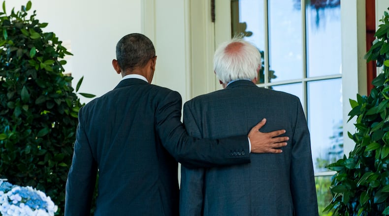 President Barack Obama and U.S. Sen. Bernie Sanders walk along the colonnade adjacent to the Rose Garden at the White House on Thursday. Sanders was meeting with Obama in the Oval Office to discuss the campaign. Pete Marovich/Abaca Press/TNS