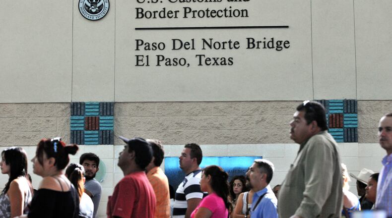 El Paso, Texas - People line up for processing by U.S. Customs and Border Enforcement at U.S. Customs and Border Protection - The Paso Del Norte Bridge in El Paso, Texas on Thursday, September 26, 2013. Some illegal immigrants are gutsy enough to try and sneak through one of the four legal ports of entry in El Paso. Every week, authorities encounter between 80 and 100 immigration violations at these gateways, according to U.S. Customs and Border Protection. Some people use phony documents. Others are imposters with stolen U.S. identification. Some are carrying illegal drugs. HYOSUB SHIN / HSHIN@AJC.COM