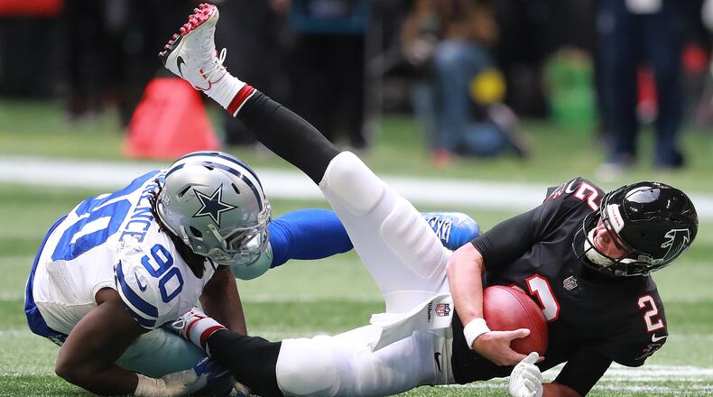 Falcons quarterback Matt Ryan is sacked by Dallas Cowboys defensive end Demarcus Lawrence during the second quarter in a NFL football game on Sunday, Nov. 18, 2018, in Atlanta. Curtis Compton/ccompton@ajc.com