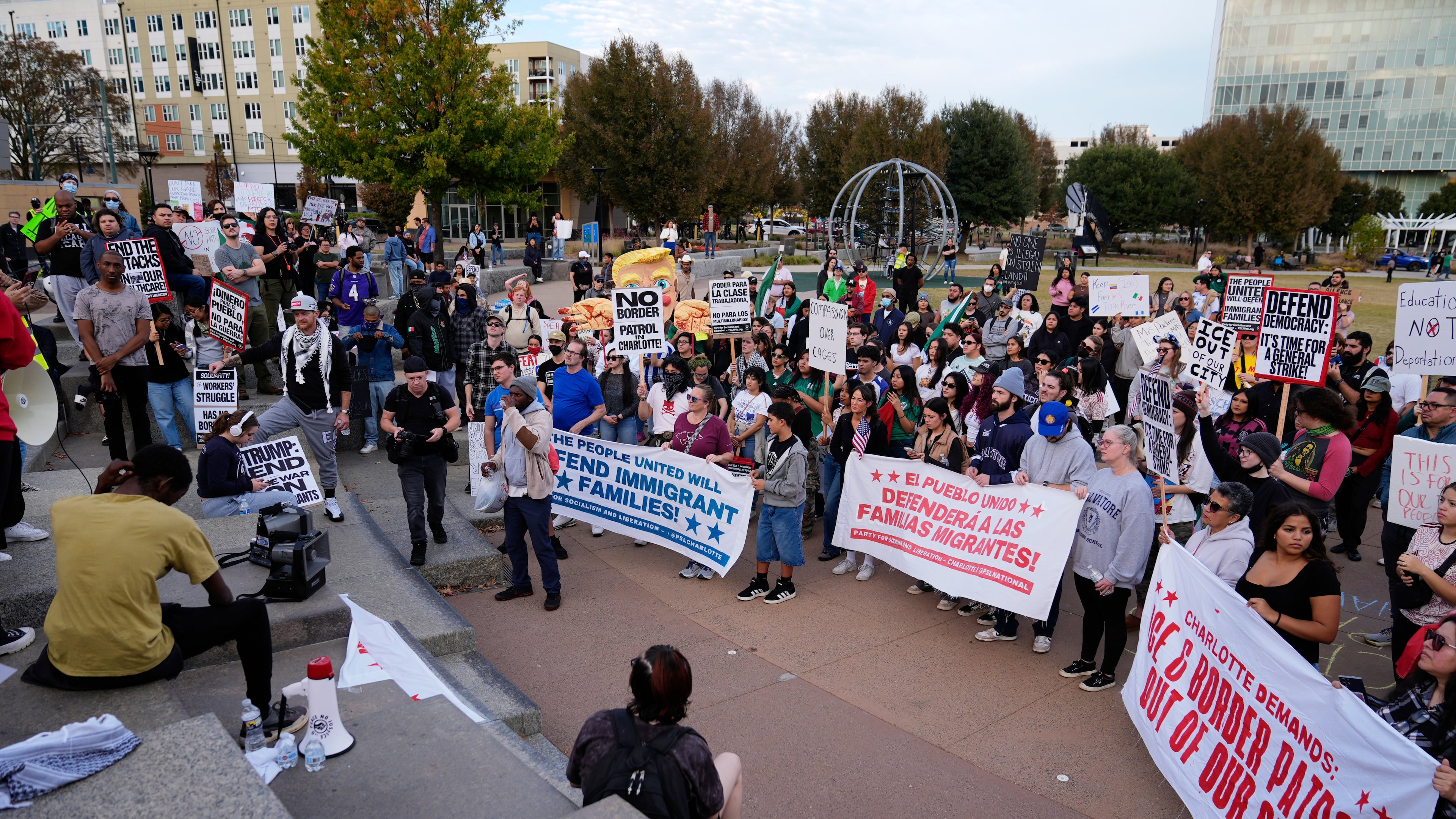People protest against federal immigration enforcement Saturday, Nov. 15, 2025, in Charlotte, N.C. (AP Photo/Erik Verduzco)