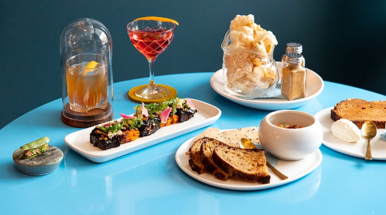 Southern Belle Beef Shortrib, Smoke and a Pancake cocktail, Now Starring cocktail, Blue Crab Beu Monde, Crispy Skins From the Farm, and Pumpkin Bread. Photo credit- Mia Yakel.