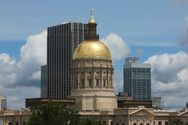 The Georgia state Capitol is seen through the windows of the Nathan Deal Judicial Center. (Jason Getz/AJC)