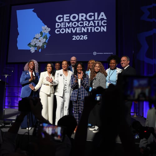 Statewide Democratic candidates, including gubernatorial candidate Keisha Lance Bottoms (center, in dark blue), gather for a photo Saturday, Aug. 1, 2026, at the Democratic Party of Georgia State Convention at the Savannah Convention Center. (Arvin Temkar/AJC)