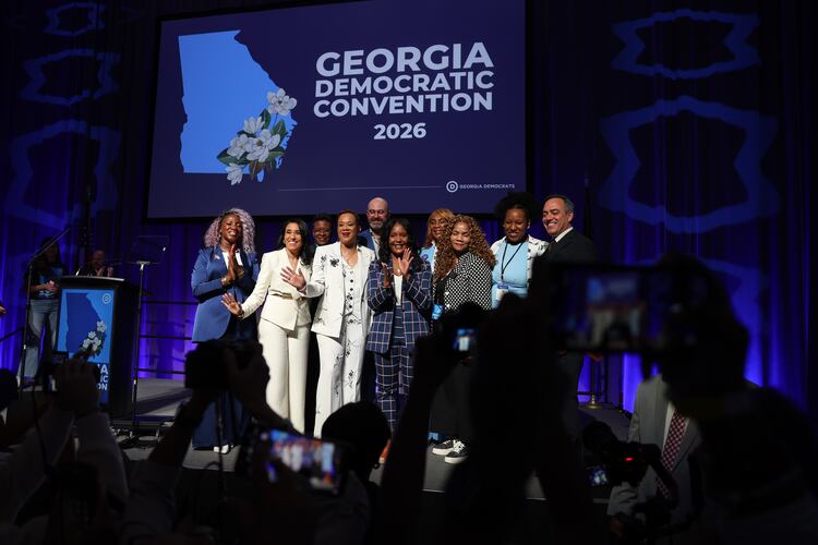 Statewide Democratic candidates, including gubernatorial candidate Keisha Lance Bottoms (center, in dark blue), gather for a photo Saturday, Aug. 1, 2026, at the Democratic Party of Georgia State Convention at the Savannah Convention Center. (Arvin Temkar/AJC)