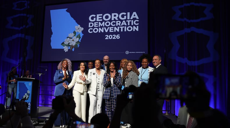 Statewide Democratic candidates, including gubernatorial candidate Keisha Lance Bottoms (center, in dark blue), gather for a photo Saturday, Aug. 1, 2026, at the Democratic Party of Georgia State Convention at the Savannah Convention Center. (Arvin Temkar/AJC)