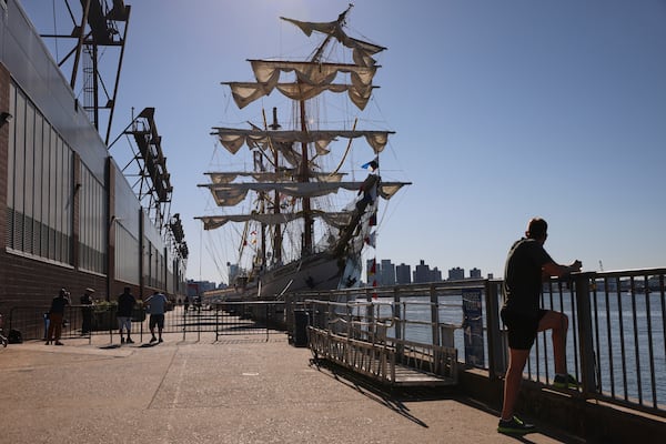 After colliding with the Brooklyn Bridge on Saturday evening, the Cuauhtémoc, a masted Mexican Navy training ship, sits docked at Pier 35 Sunday, May 18, 2025, in New York. (AP Photo/Yuki Iwamura)