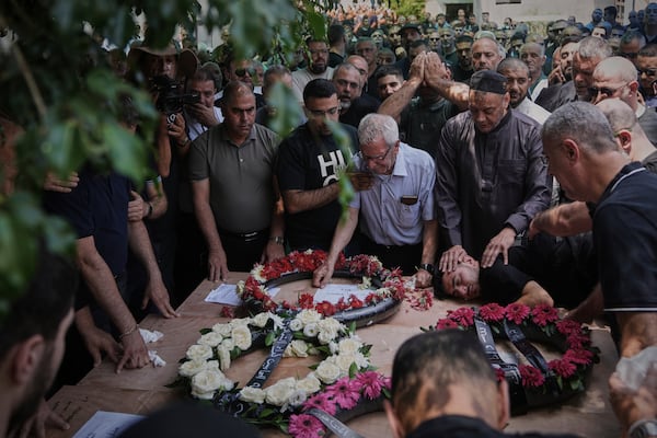 Relatives attend the funeral of four members of the Khatib family, Palestinian citizens of Israel killed in an Iranian missile strike on Tamra, Israel, on Tuesday, June 17, 2025. (AP Photo/Mahmoud Illean)