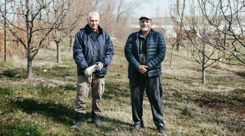 Calvin Hoover and Jim Jarsulic founders of Turner Community Garden in the garden’s orchard in Kansas City, Kansas. (Chase Castor/The Beacon)