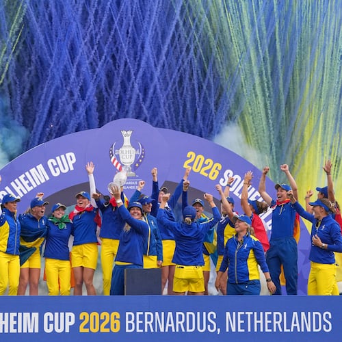 Anna Nordqvist Europe team captain holds the trophy aloft after her team won the Solheim Cup in Den Bosch, Netherlands, Sunday, Sept. 13, 2026. (AP Photo/Alastair Grant)