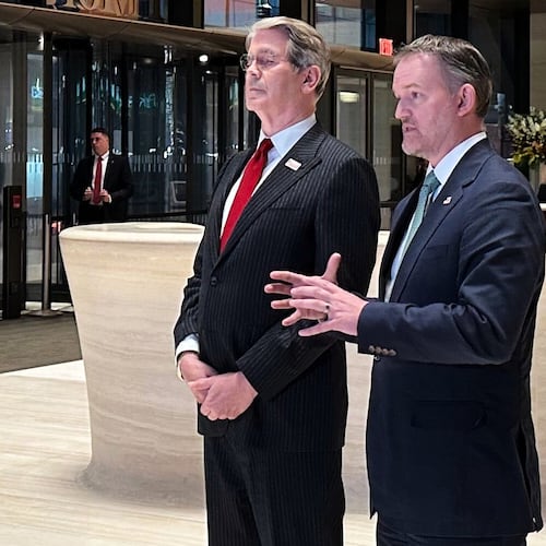 In this photo taken with a smartphone, U.S. Treasury Secretary Scott Bessent, left, and U.S. Trade Representative Jamieson Greer, address reporters in New York, Sunday, Sept. 20, 2026. (AP Photo/Matt Sedensky)