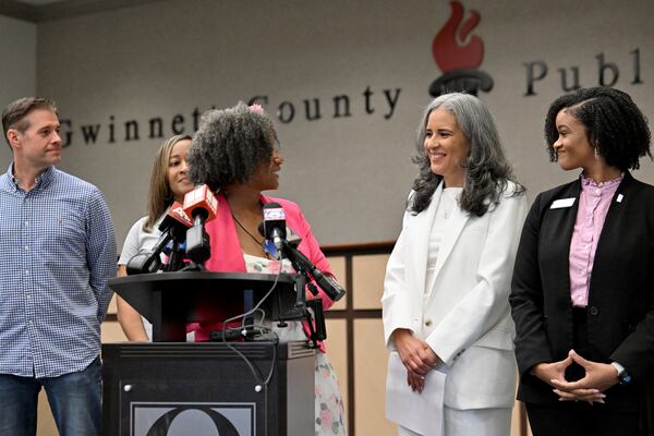Gwinnett County Board of Education chair Tarece Johnson-Morgan (center left) introduces incoming Superintendent Alexandra Estrella during a news conference on Saturday, April 4, 2026, in Suwanee. (Hyosub Shin/AJC)