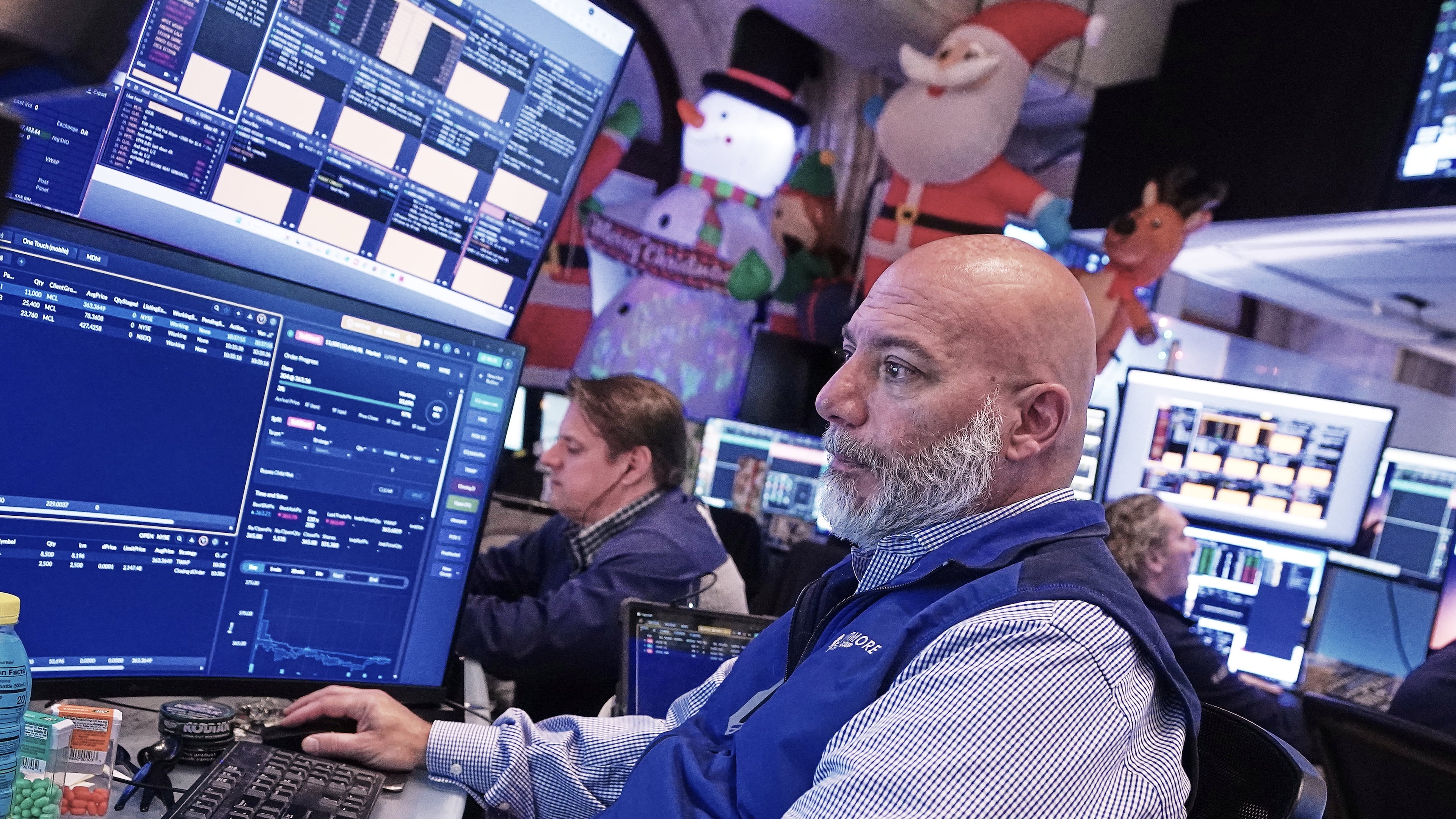 Trader Vincent Napolitano works on the floor of the New York Stock Exchange, Tuesday, Dec. 2, 2025. (AP Photo/Richard Drew)