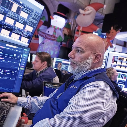 Trader Vincent Napolitano works on the floor of the New York Stock Exchange, Tuesday, Dec. 2, 2025. (AP Photo/Richard Drew)