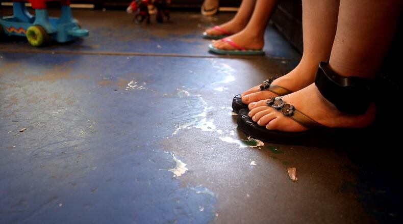 Immigrant Melida Patricio Castro from Honduras shows a birth certificate for her daughter Maria Celeste, 2, to a U.S. Border Patrol agent near the U.S.-Mexico border on July 24, 2014 near Mission, Texas. Tens of thousands of undocumented immigrants, many of them families or unaccompanied minors, have crossed illegally into the United States this year and presented themselves to federal agents, causing a humanitarian crisis on the U.S.-Mexico border. The Rio Grande sector has the highest traffic of illegal immigration, especially of Central Americans, on all the U.S.-Mexico border. (Photo by John Moore/Getty Images)