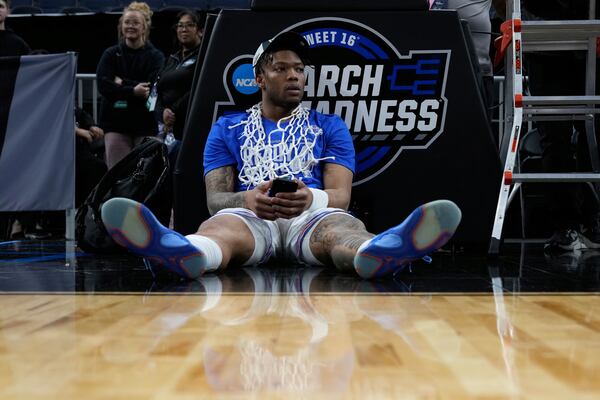 Florida guard Alijah Martin sits on the court after defeating Texas Tech in the Elite Eight of the NCAA college basketball tournament, Saturday, March 29, 2025, in San Francisco. (AP Photo/Godofredo A. Vásquez)