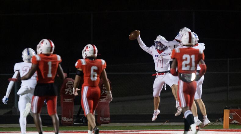Walton's Nate Lyons (11) celebrates a touchdown during a GHSA high school football playoff game between the Archer Tigers and the Walton Raiders at Archer High School in Lawrenceville, GA., on Friday, November 19, 2021. (Photo/Jenn Finch)