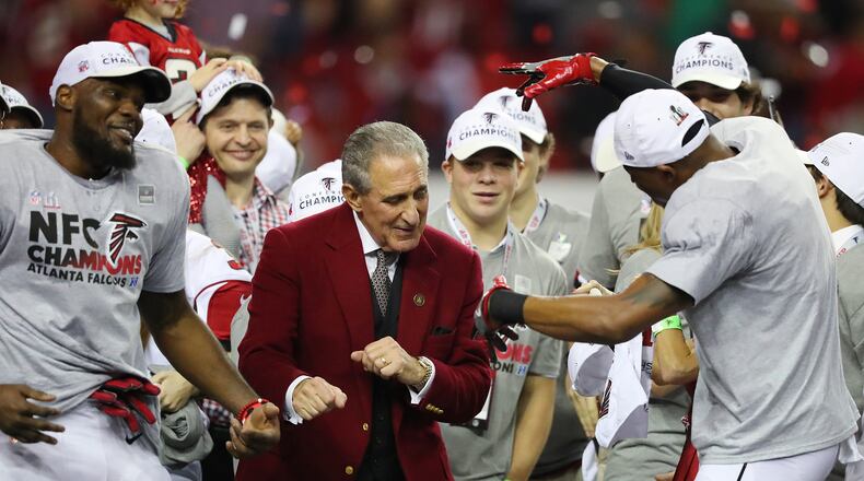 Falcons owner Arthur Blank dances on stage with his players after beating the Packers 44-21 in the NFL football NFC Championship game on Sunday, Jan. 22, 2017, in Atlanta. Curtis Compton, ccompton@ajc.com