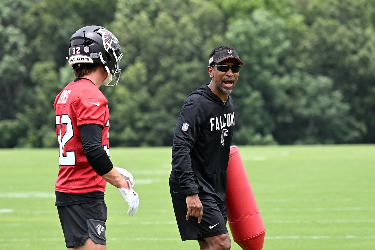 Falcons wide receivers coach Robert Prince (right) gives instructions during an OTA workout on Wednesday, May 27, 2026, in Flowery Branch. Prince is responsible for maximizing Atlanta’s receiving corps, no matter the form it takes. (Hyosub Shin/AJC)