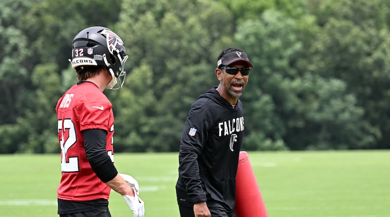 Falcons wide receivers coach Robert Prince (right) gives instructions during an OTA workout on Wednesday, May 27, 2026, in Flowery Branch. Prince is responsible for maximizing Atlanta’s receiving corps, no matter the form it takes. (Hyosub Shin/AJC)