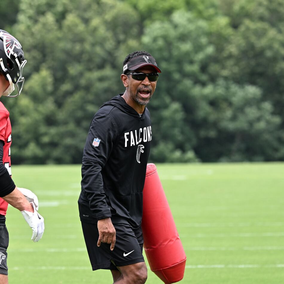 Falcons wide receivers coach Robert Prince (right) gives instructions during an OTA workout on Wednesday, May 27, 2026, in Flowery Branch. Prince is responsible for maximizing Atlanta’s receiving corps, no matter the form it takes. (Hyosub Shin/AJC)