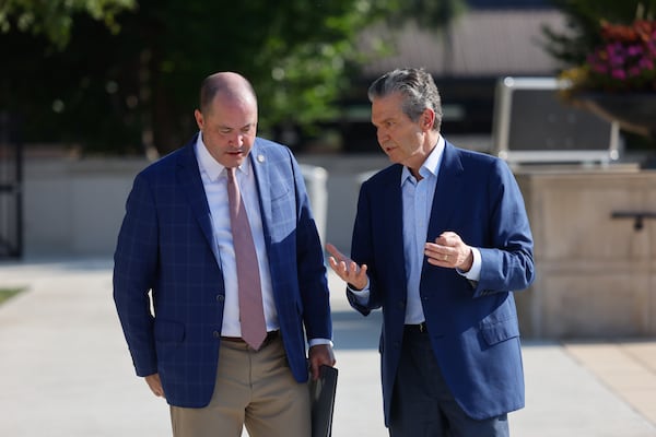 Attorney General Chris Carr (left) speaks with Republican nominee for governor Rick Jackson after a news conference in Atlanta on Wednesday. (Arvin Temkar/AJC)