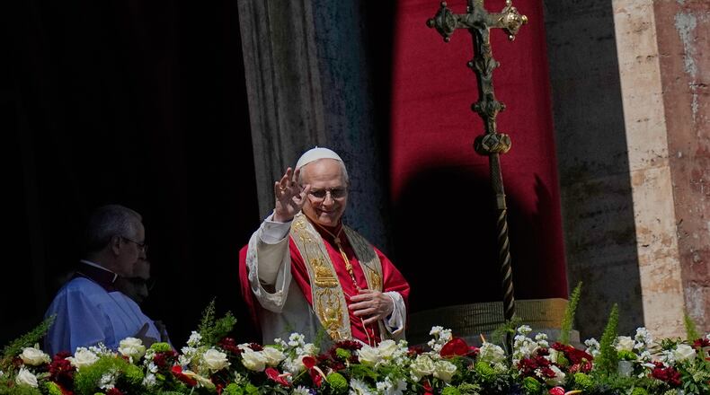 Pope Leo XIV addresses the faithful after delivering the Urbi et Orbi blessing - Latin for "to the city of Rome and to the world" - from the central loggia of St. Peter's Basilica at the end of Easter Mass he presided over in St. Peter's Square at the Vatican, Sunday, April 5, 2026. (AP Photo/Alessandra Tarantino)
