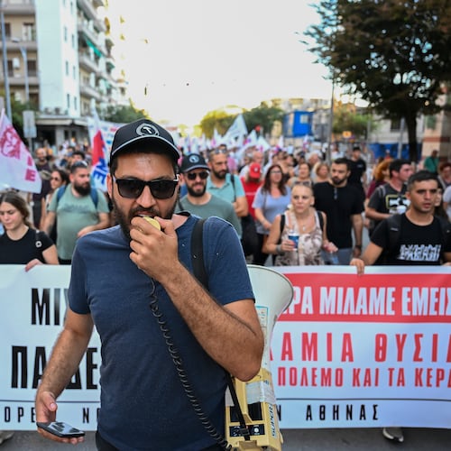 A protester shouts slogans with a megaphone during a protest rally near Thessaloniki's international trade fair, in the northern city of Thessaloniki, Greece, Saturday, Sept. 5, 2026. (AP Photo/Giannis Papanikos)