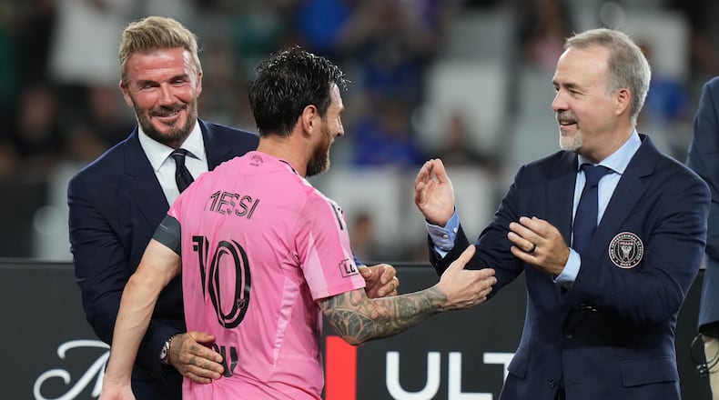 Inter Miami co-owners David Beckham, left, and Jose Mas, right, celebrate with Lionel Messi (10) after Inter Miami defeated Cruz Azul in the Campeones Cup soccer match, Wednesday, Sept. 16, 2026, in Miami. (AP Photo/Lynne Sladky)