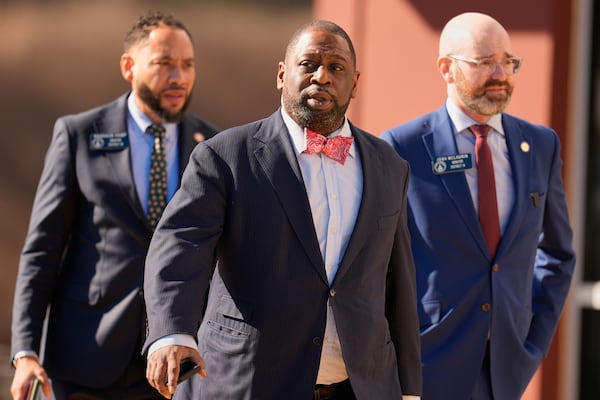 (Left to right) State Sen. RaShaun Kemp, Fulton County Commissioner Marvin Arrington Jr. and state Sen. Josh McLaurin turned out in Union City, as  FBI agents search at the Fulton County Election Hub and Operation Center on Wednesday. (Mike Stewart/AP)