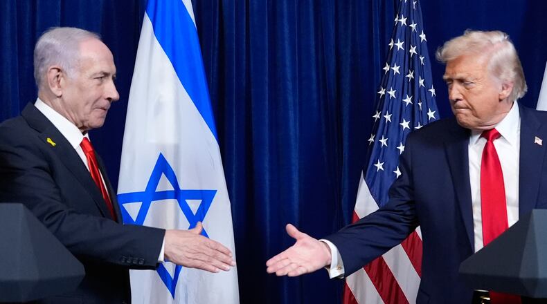 FILE - President Donald Trump shakes hands with Israel's Prime Minister Benjamin Netanyahu at the end of a news conference at Mar-a-Lago, Dec. 29, 2025, in Palm Beach, Fla. (AP Photo/Alex Brandon, File)