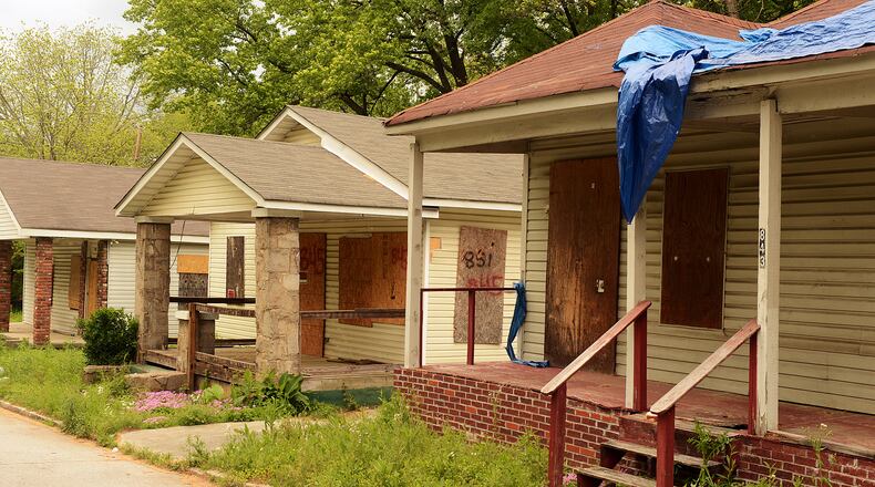 Boarded up properties in the 800 block of Proctor Street in the English Avenue area of Atlanta are shown. Ten years ago in March, the state of Georgia repealed strict borrower protection laws that sought to curb predatory lending in the mortgage industry. In the years that followed, subprime loans fueled a homeownership and real estate speculation wave.