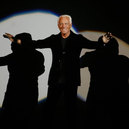 FILE - Giorgio Armani receives his share of applause after presenting his Emporio Fall-Winter 2007-2008 men's fashion collection, during the Milan Men's Fashion Week, in Milan, Italy, Monday, Jan. 15, 2007. (AP Photo/Luca Bruno, File)