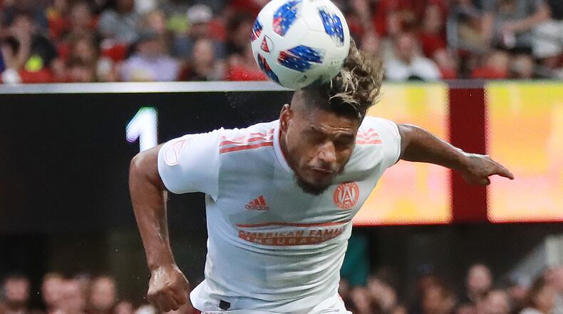 Atlanta United forward Josef Martinez smashes a header against Columbus Crew Sunday, Aug. 19, 2018, in Atlanta.